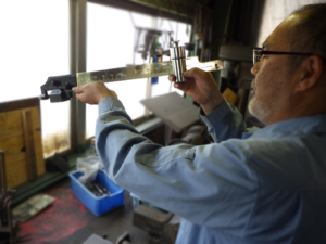 機械式はかり（さお式）の調整技術